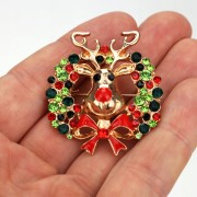 PINETS Broszka świąteczna renifer z wianuszkiem