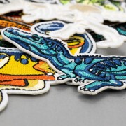 ZESTAW 9 szt Naprasowanki haftowane Dinozaury