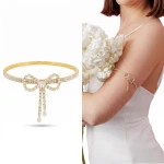 Bransoletka arm cuff złota z kokardką błyszcząca damska ślubna glamour