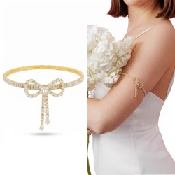 Bransoletka arm cuff złota z kokardką błyszcząca damska ślubna glamour